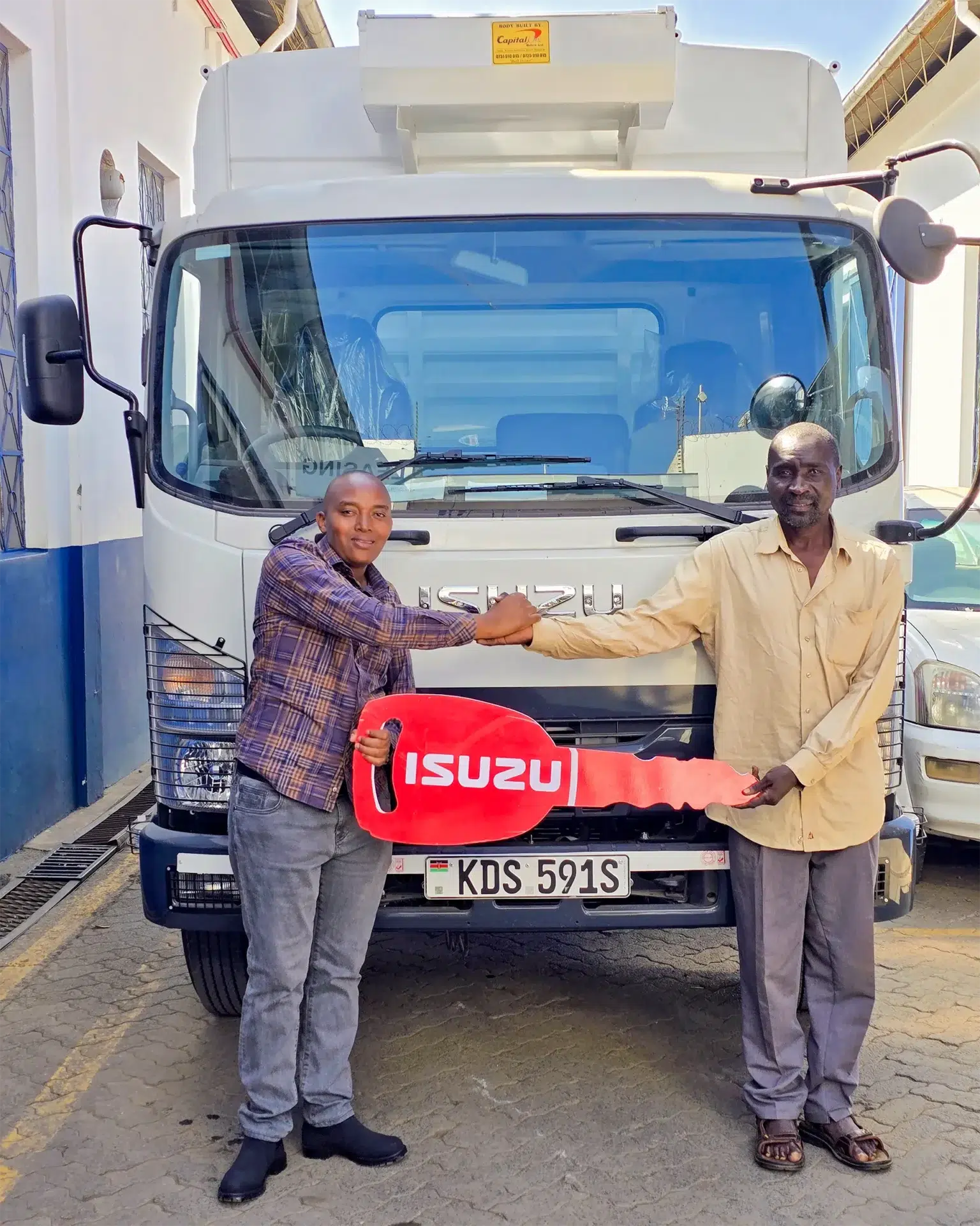 Gilgal Construction Agency receives their new Isuzu FRR 90 BLUEPOWER from Isuzu Kenya, showcasing top-tier customer satisfaction and reliable Isuzu trucks for sale in Nairobi.