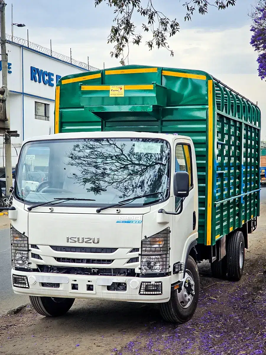 Front view of a new Isuzu NQR 81 Bluepower truck with a custom blue cargo body.